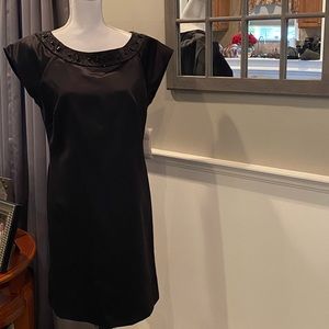 Woman black satin cocktail dress